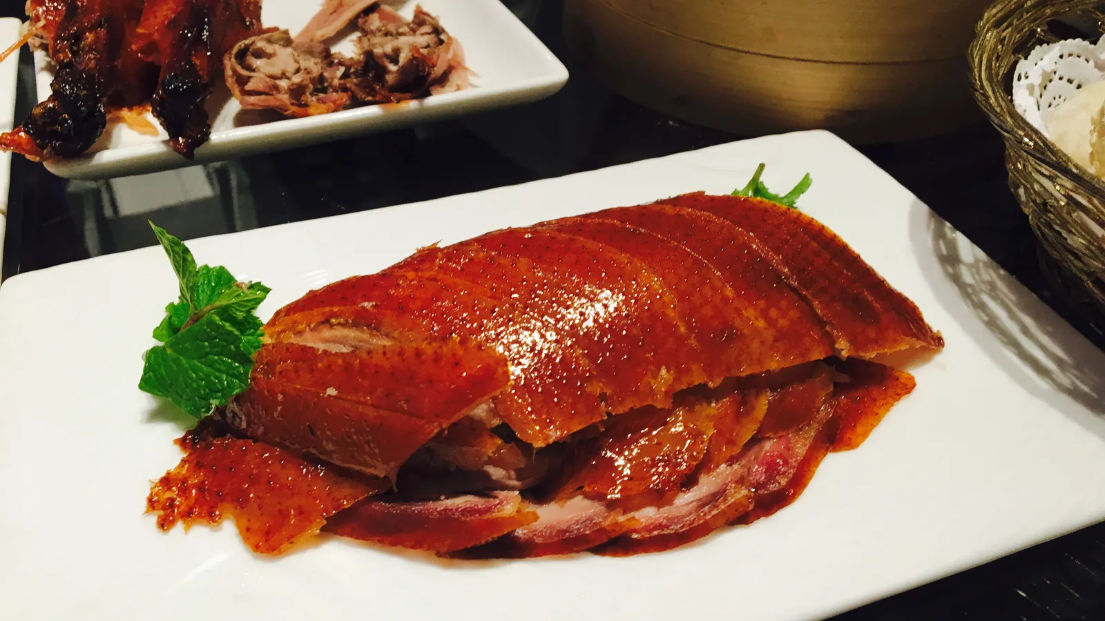 Sliced Peking duck with crisp amber skin