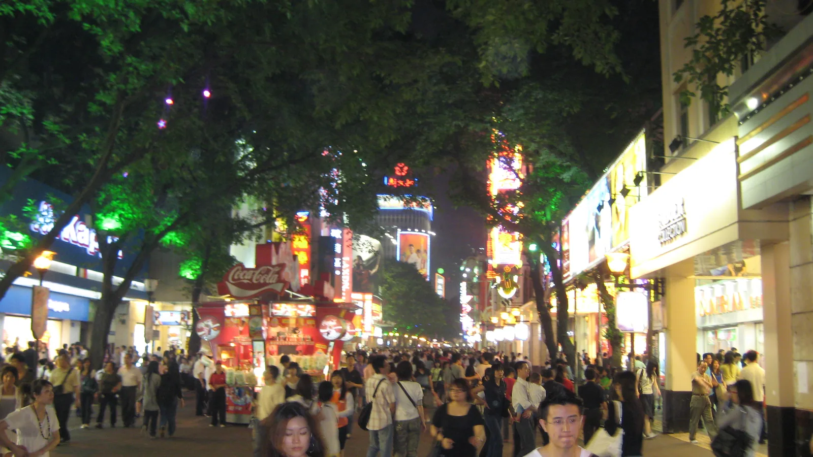 Crowds and illuminated storefronts on Beijing Road pedestrian street in Guangzhou