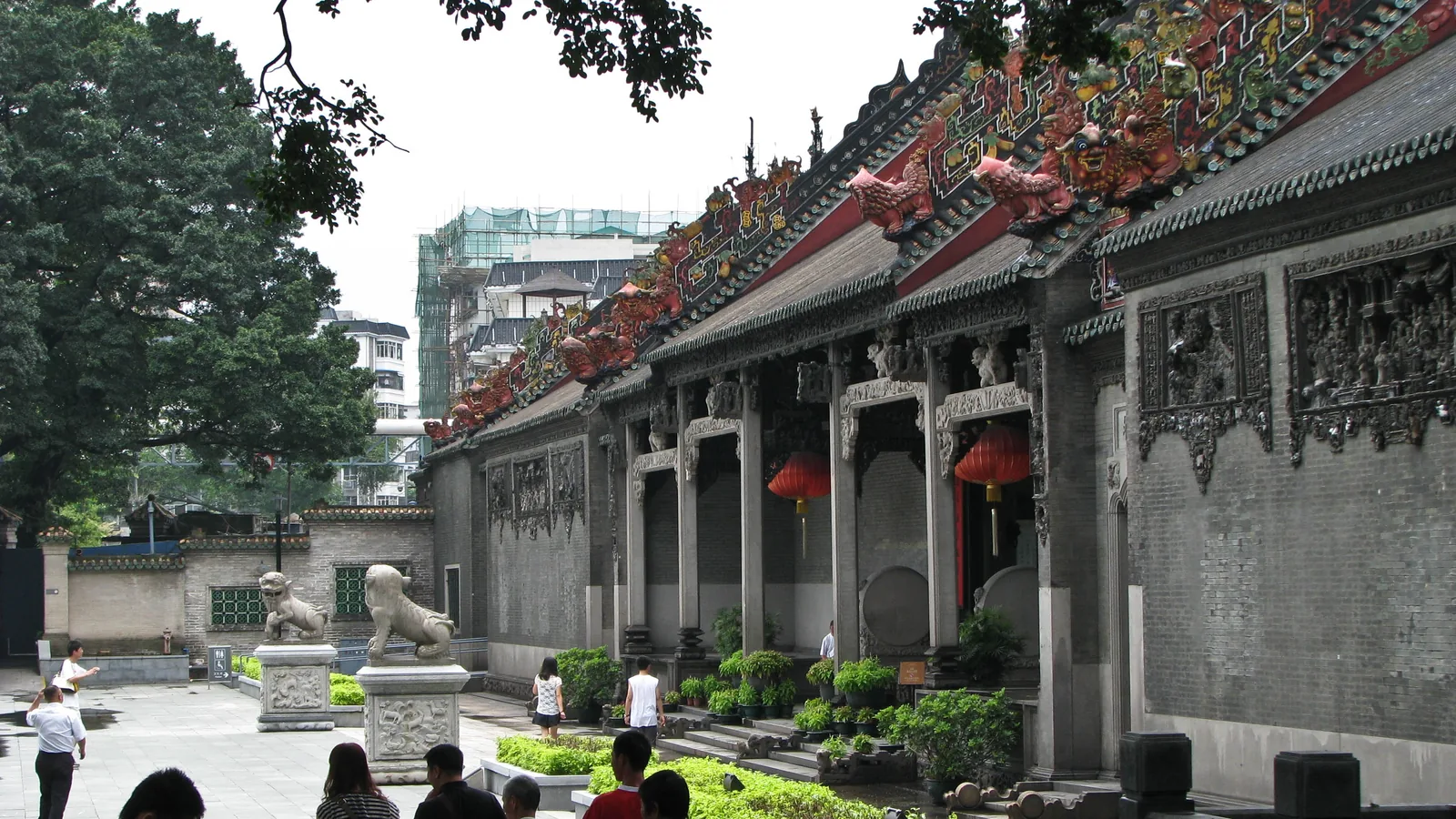 Ornate roof sculpture and carved stone façade at Chen Clan Ancestral Hall in Guangzhou