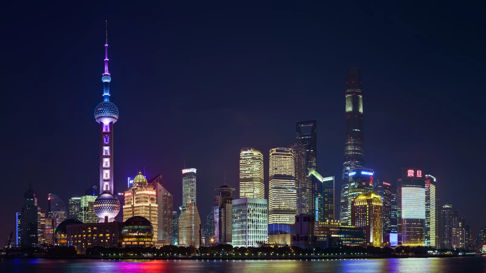 The Bund waterfront facing the Pudong skyline across the Huangpu River